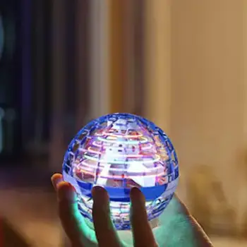 hand holding Cosmic Globe while it's glowing